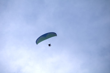 paraglider in the sky,motorized, sport, fly, blue, paraglider,extreme, flying, adventure, air, freedom, gliding,activity, wind, high, 