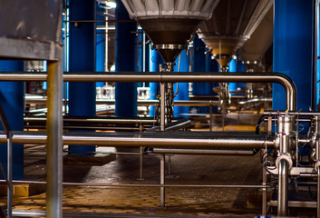 Stainless steel pipes in the factory. Construction on food production, Abstract industry background.