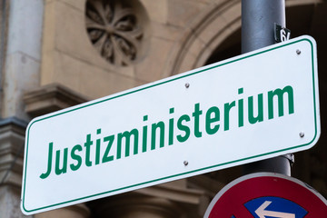 Street sign with the German text Justizministerium (Ministry of Justice)