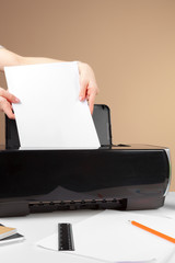 Woman using the printer to scanning and printing document