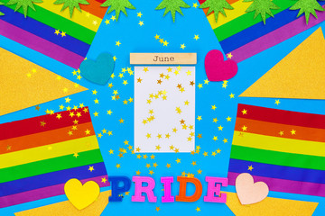 Gay pride flag on wooden table