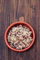 boiled healthy rice in brown ceramic pot