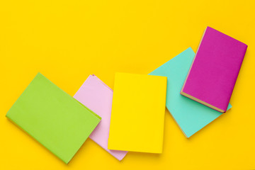 Books on a yellow background