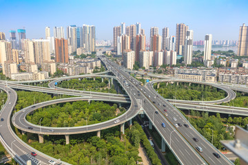 city highway interchange with blue sky, aerial view of modern traffic background.Wuhan, the largest...