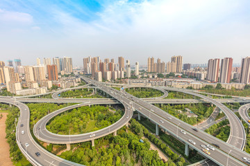 Fototapeta na wymiar city highway interchange with blue sky, aerial view of modern traffic background.Wuhan, the largest transportation and economic hub city in central China.