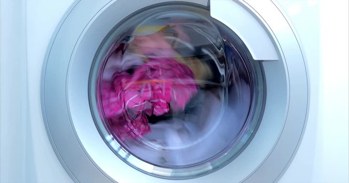 Close Up Industrial Washing Machine Washes Colored Clothing and White Linen, White Striped Clothing. Cylinder Spinning Machine. Concept Laundry Washing Machine, Industry Laundry Service.