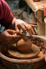 Potter at work. Workshop.