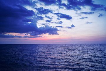 Beautiful seascape with cloudy sky. Sunset on the beach.