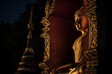 Buddha Statue Near Stupa at Night