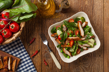 Delicious salad with grilled veal, beetroot and cucumber. Top view.