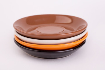 Fours plates of black, white, orange and brown colors, isolate