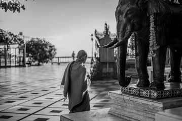 Buddhist Monk at Walking Around Wat After Sunrise