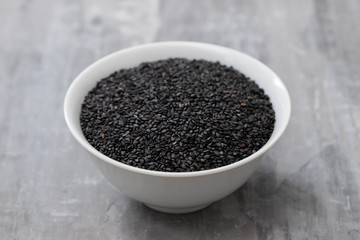 seeds of black sesame in the white bowl