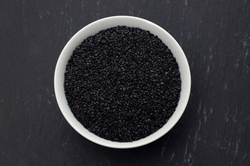 seeds of black sesame in the white bowl