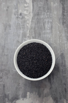 seeds of black sesame in the white bowl © Natalia Mylova