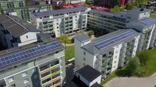 Aereal view of solar panels on the rooftops of house complexes in Stockholm, Sweden