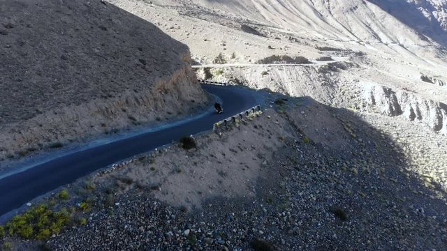 4k aerial motorbiker following in mountain area in Ladakh in India