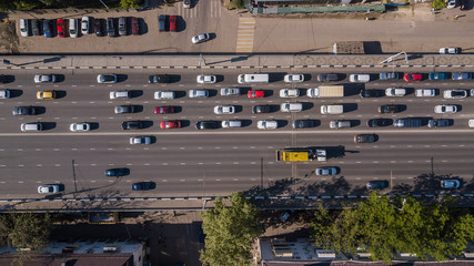 Top down aerial view of urban traffic jam rush hour highway.
