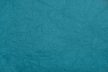 Abstract textured paper emerald blue-green color background.