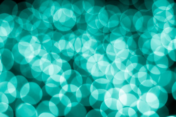 Abstract bokeh background. Soft defocused lights. Neon basic cyan color