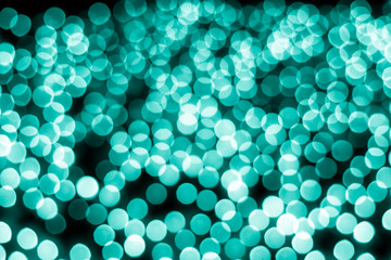Abstract bokeh background. Soft defocused lights. Neon basic cyan color