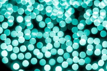 Abstract bokeh background. Soft defocused lights. Neon basic cyan color