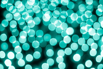Abstract bokeh background. Soft defocused lights. Neon basic cyan color