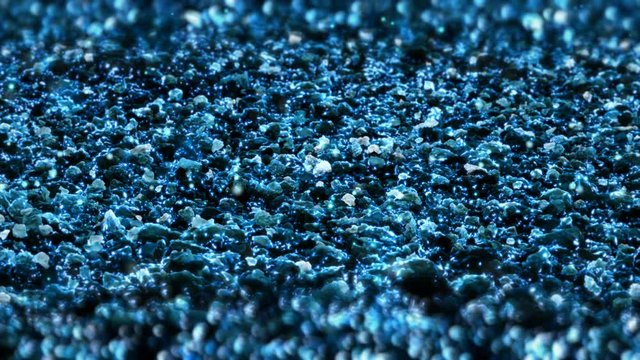 Blue Shiny glitter background abstract texture close up macro seamless loop particles