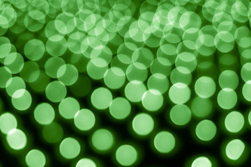 Abstract bokeh background. Soft defocused lights. Neon basic green color