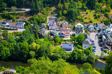 View of the village and valley of Vianden, with mountains and forest, and the Our river crossing, in Luxembourg, Europe
