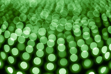 Abstract bokeh background. Soft defocused lights. Neon basic green color