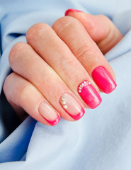  Woman's nails with beautiful pink manicure fashion design