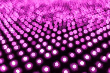 Abstract bokeh background. Soft defocused lights. Neon basic pink color