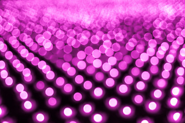 Abstract bokeh background. Soft defocused lights. Neon basic pink color