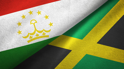 Fototapeta premium Tajikistan and Jamaica two flags textile cloth, fabric texture