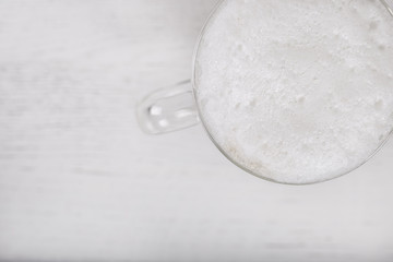 Close up of coffee latte on white wood background. Flat lay with free space