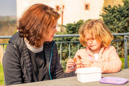 Woman with child picnic on castle Scharfenstein