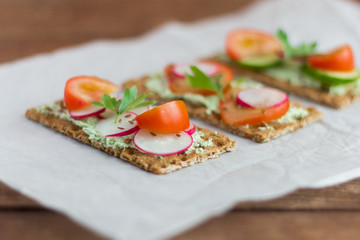 delicious diet sandwiches with cottage cheese with herbs and vegetables ,close-up,selective focus