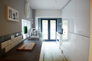 Kitchen in a refurbished house, looking towards back door