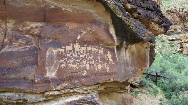 View of petroglyphs carved into the cliffs in Utah rotating around The Great Hunt Panel in Nine Mile Canyon.