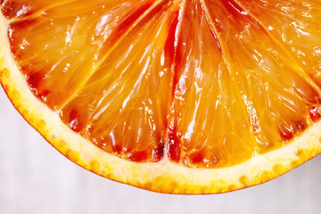 Close up macro of fresh organic Sicilian blood oranges sliced.