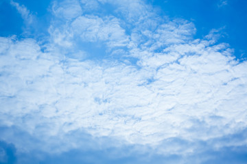 Fototapeta na wymiar Cirrus clouds against the dark blue sky. Heavenly background. Pattern of clouds in the blue sky, blue sky with cloud