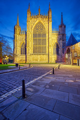 Fototapeta premium The backside of the York Minster and some half-timbered houses at dusk