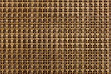 Interlaced checkered pattern of brown and beige lines. rough surface texture