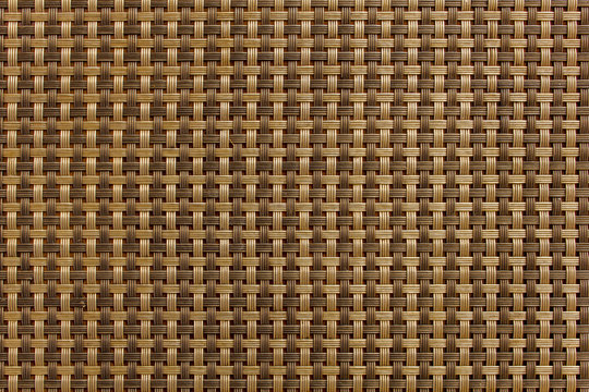 Interlaced checkered pattern of brown and beige lines. rough surface texture