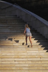 Girl training in the stairs