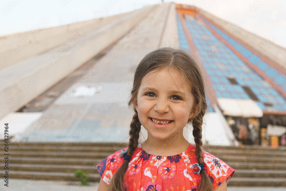 Wall mural smiling girl in colorful dress