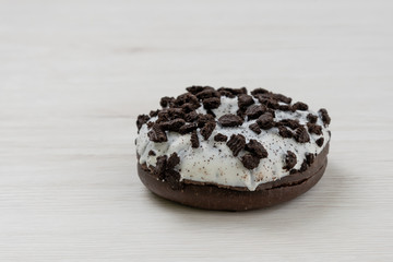 Donut on a white wood background, close-up