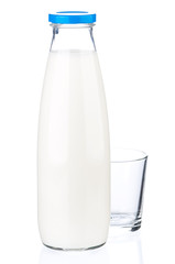 Bottle of milk and empty glass isolated on white background