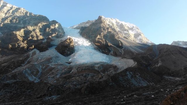 4k aerial dolly out of glacial ice fall in Langtang Valley in Nepal